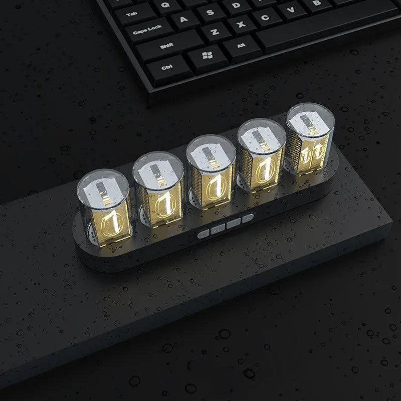 RGB LED digital clock showing colour-changing display on desk with black plastic casing
