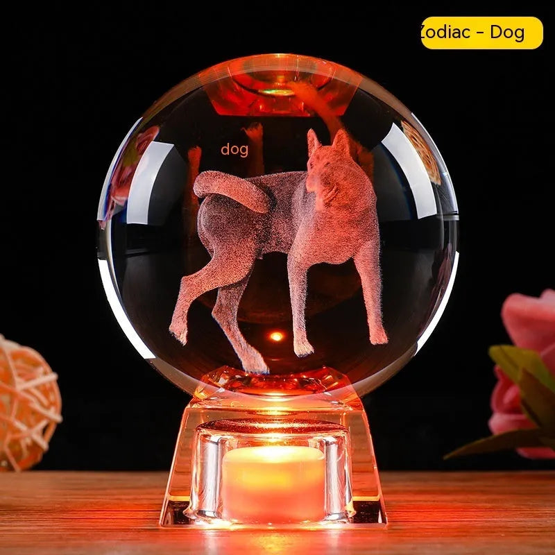 White crystal zodiac decorative ball with electronic base lighting showing Chinese-style animal design