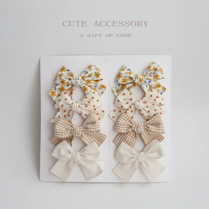 Children's cloth hairclips with dovetail bow decoration in multiple colour options