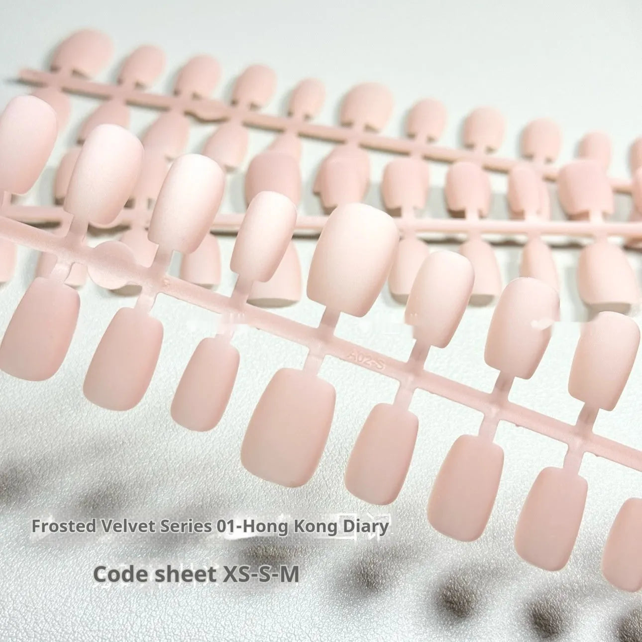 Set of frosted velvet finish press-on nails with Cat's Eye and aurora effects, showing short ladder XS, S, and M sizes.