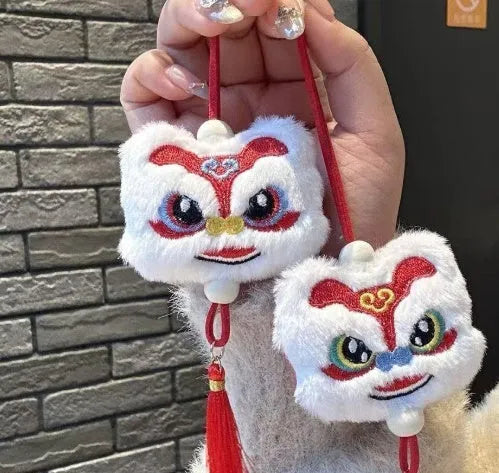 Blue and yellow handmade plush lion keychain with star stones and tassels in Chinese cartoon style