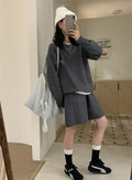 Women's milk blue knitted sweater and shorts set with animal embroidery pattern.
