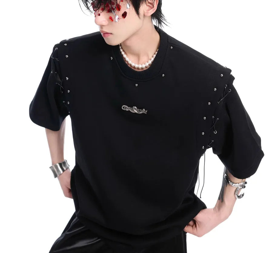Short sleeve black top with a white lace-up cutout detail on the front, deconstruction style.