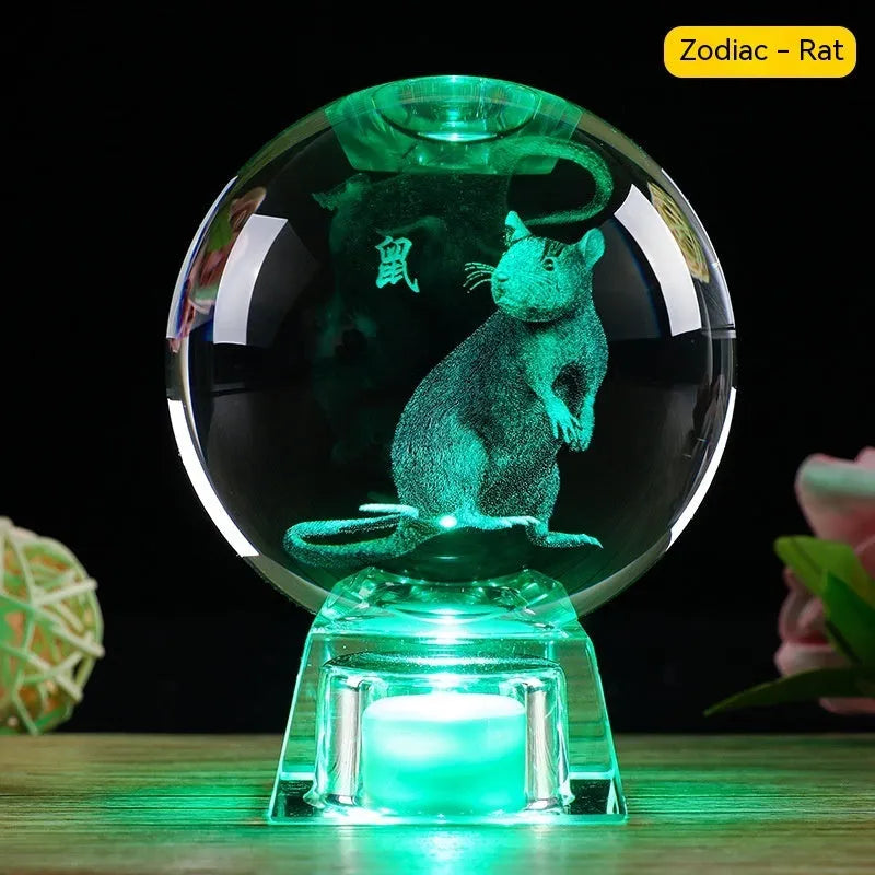 White crystal zodiac decorative ball with electronic base lighting showing Chinese-style animal design