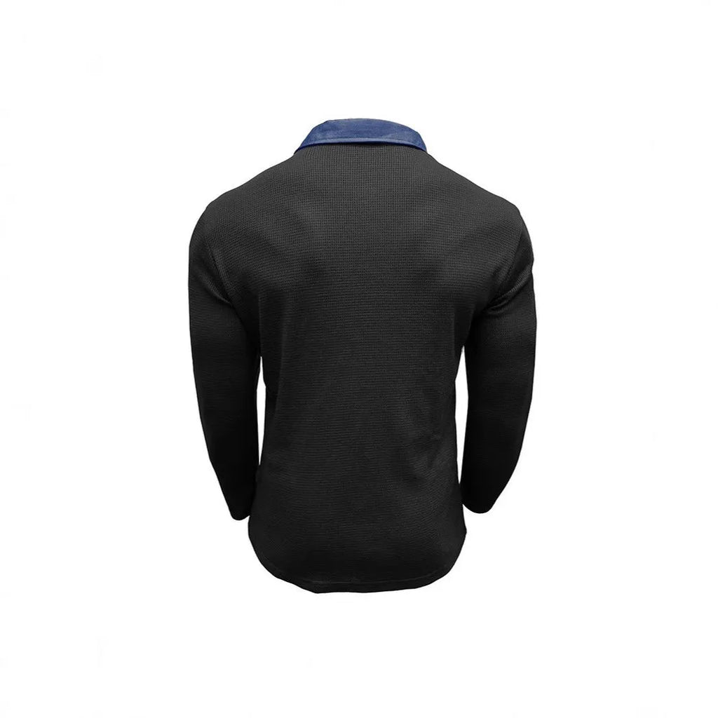 Man wearing a long-sleeved waffle knit polo shirt in a solid colour with an asymmetric design detail.