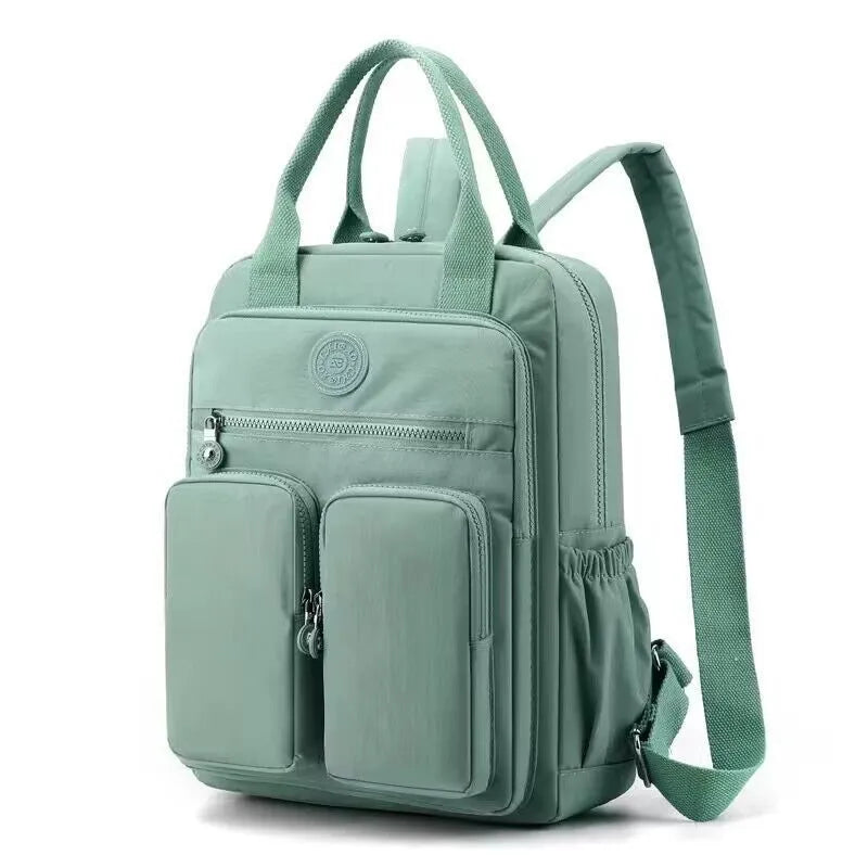 Women's waterproof nylon travel backpack with multiple internal compartments in various colours