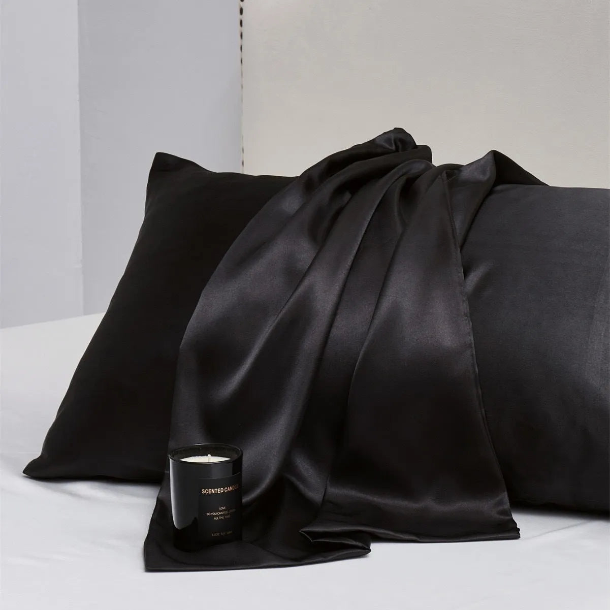 Pair of solid colour satin cloth pillowcases showing colour options including navy blue, wine red and light pink