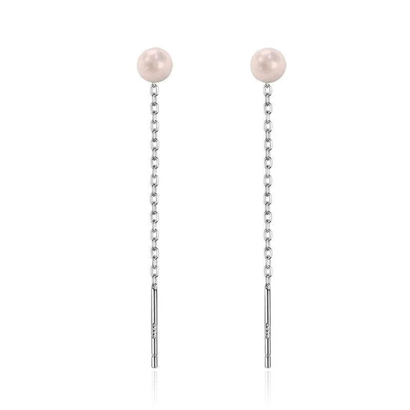 Long sterling silver needle ear string with a choice of geometric or pearl pendants for women.