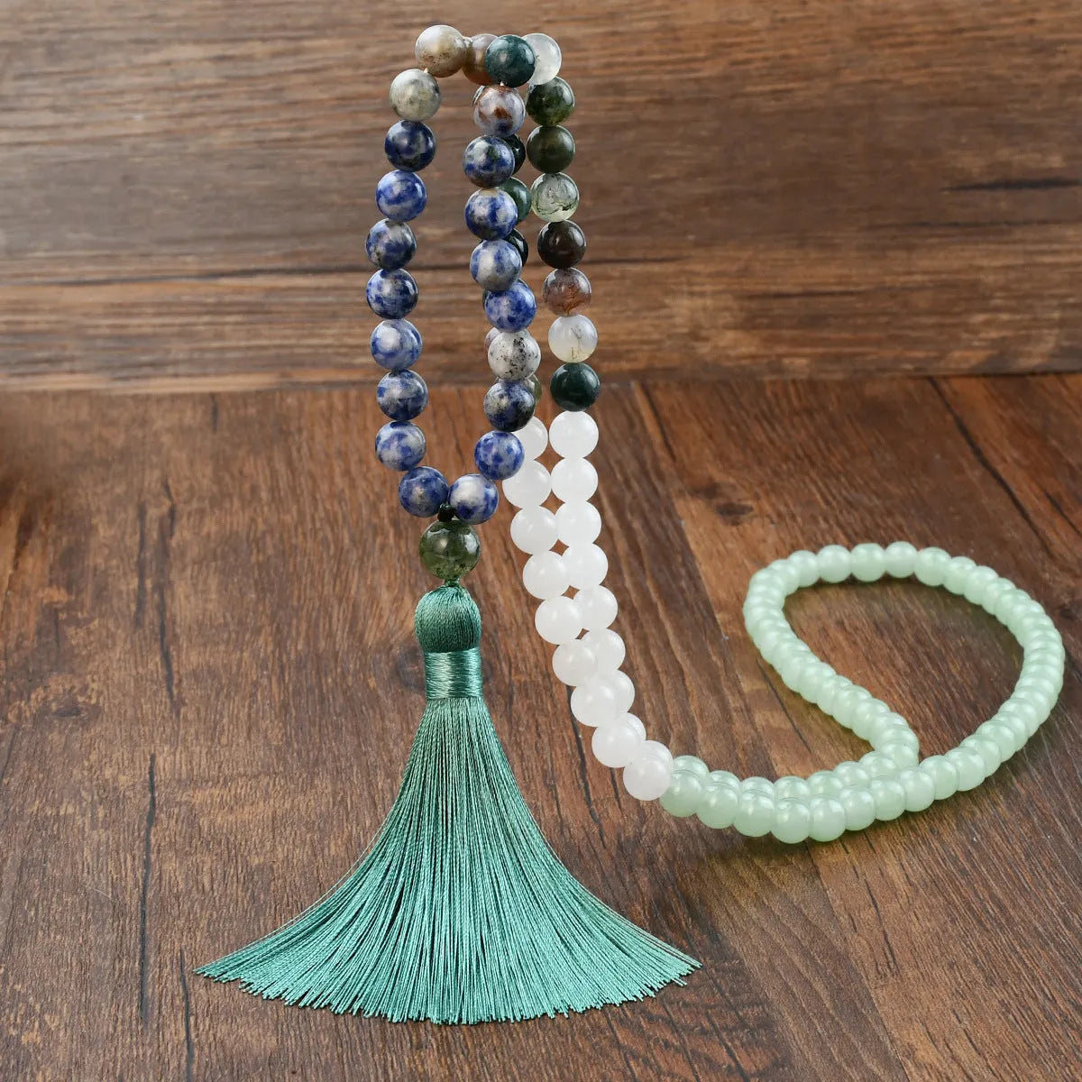 Long bohemian necklace with 108 natural stone beads, a geometric pendant, and a coloured tassel on a ball bead chain.