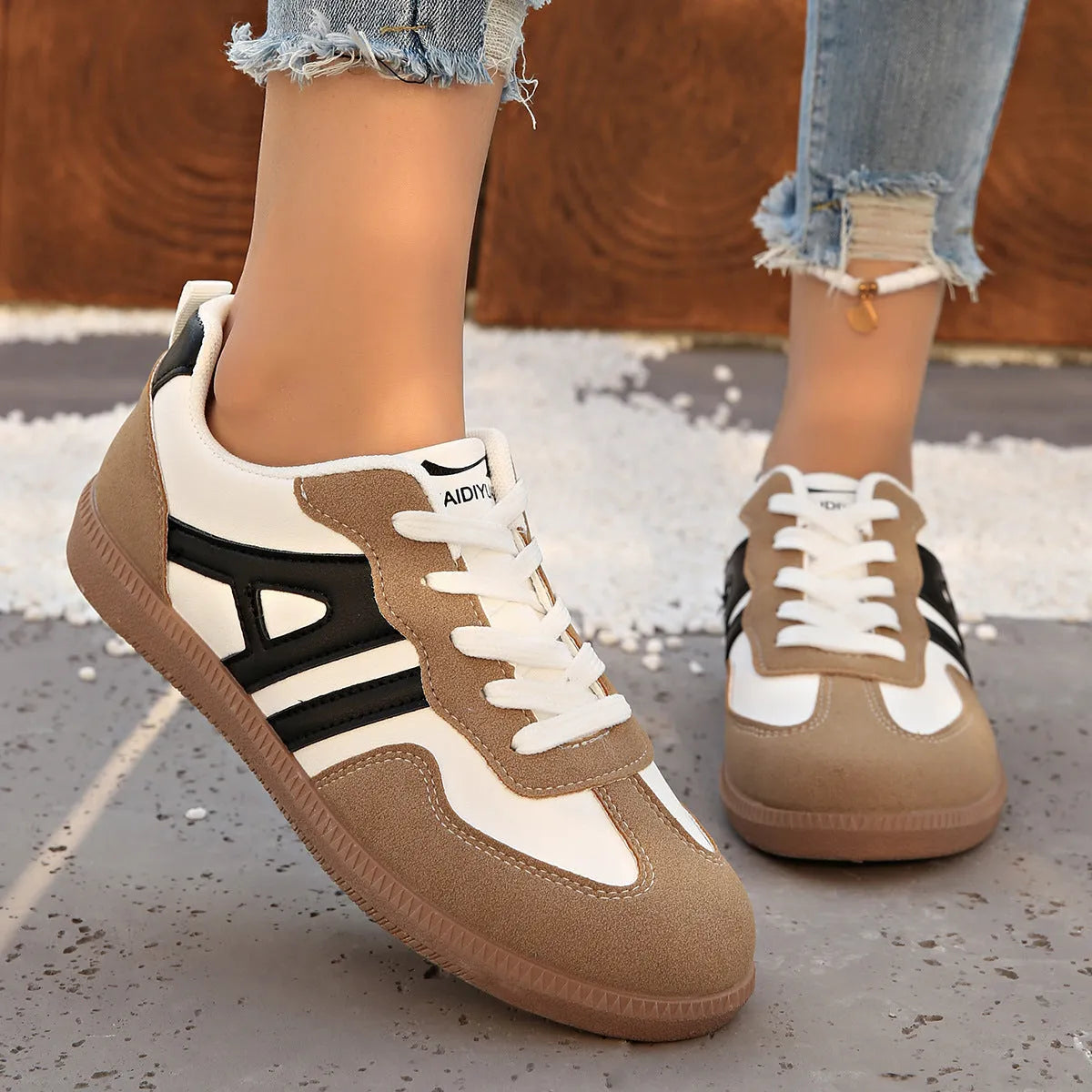 Women's retro colour matching lace-up trainers in black, grey or khaki with low heel platform and cross strap details