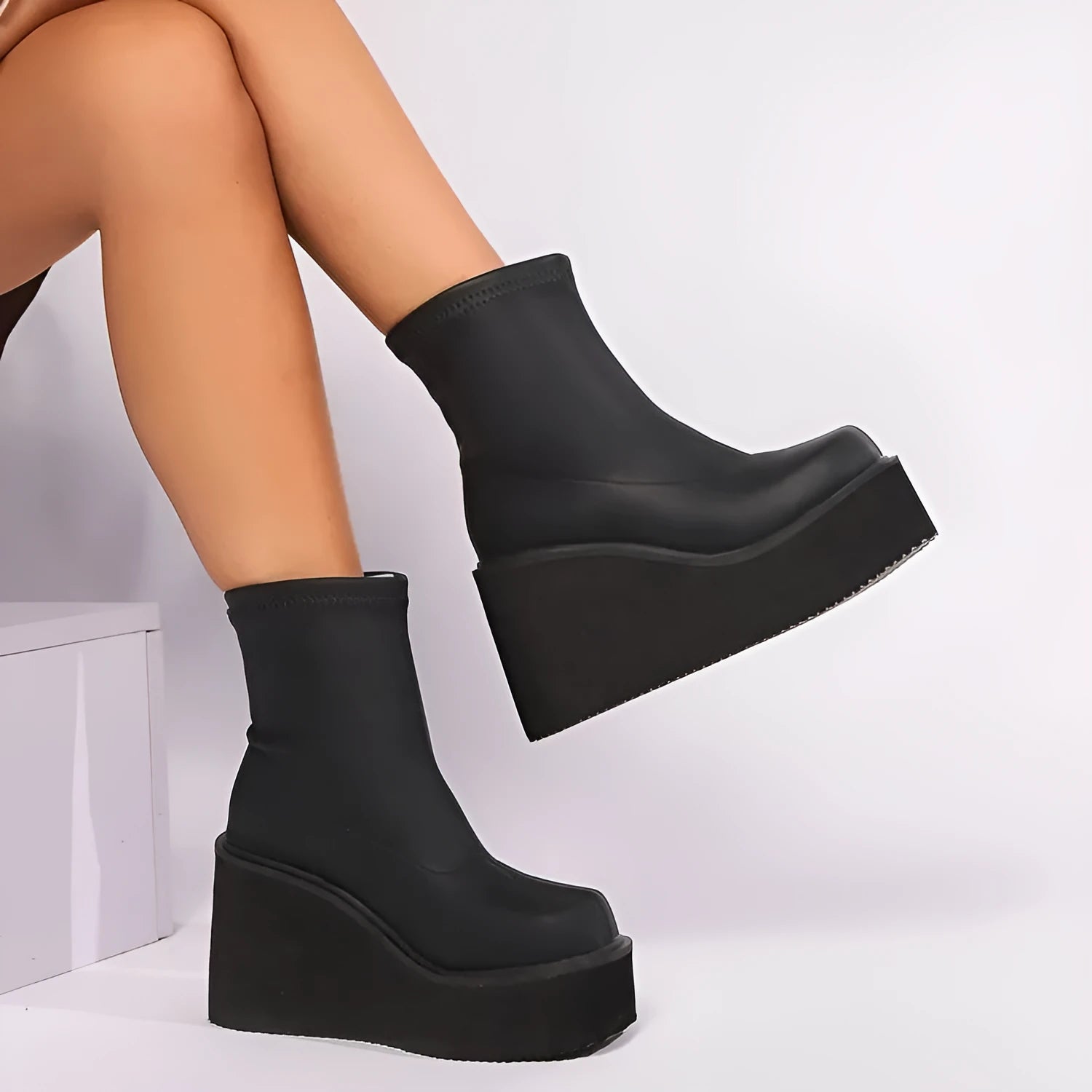 Women's black wedge heel boots with round toe, waterproof platform, and high cylinder design