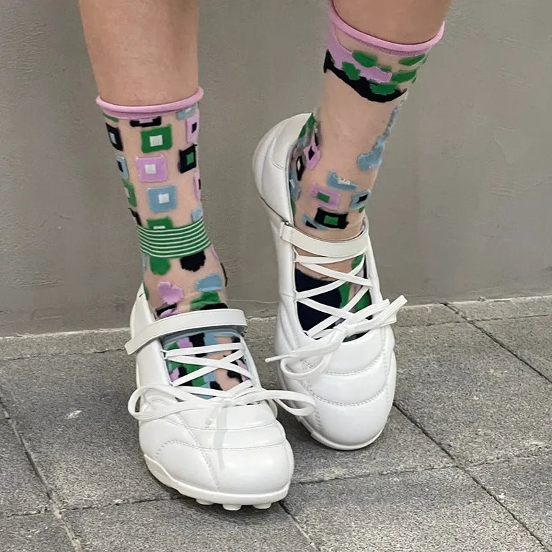 Women's silver creative lace-up bow sports shoes with mid heel and round toe on a white background.