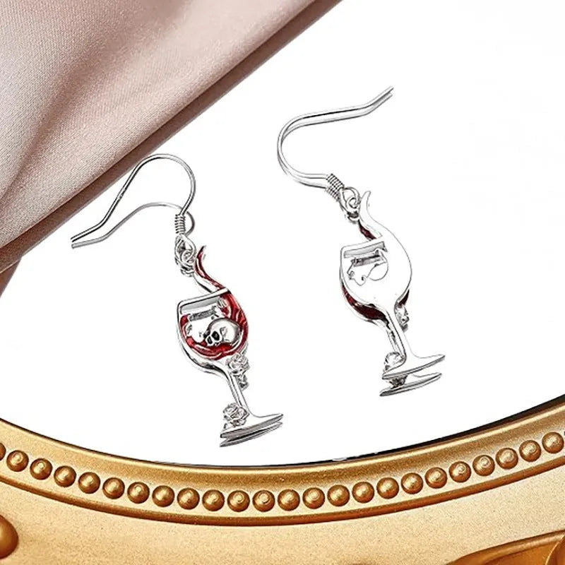 A pair of zinc alloy electroplated earrings with a combined skull and wine glass geometric design.