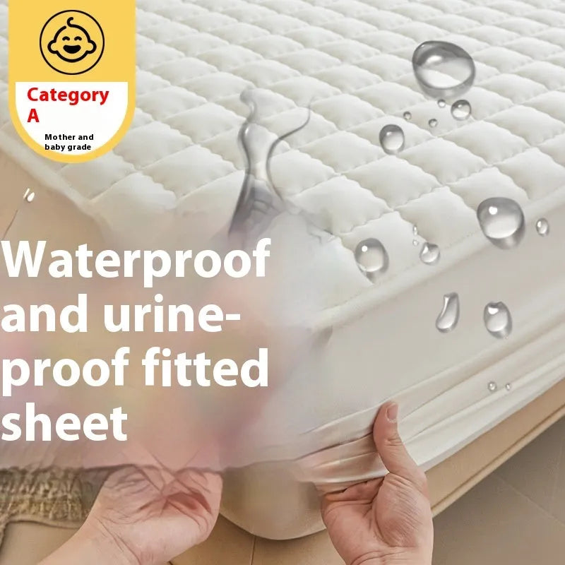 Blue washed cotton fitted sheet with quilted pattern on a bed, showcasing its waterproof protection feature.