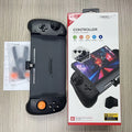 Black and white portable Nintendo Switch gamepad controller showing USB-C port.