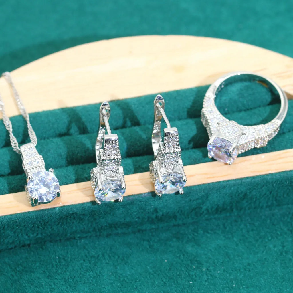 Bridal zircon four-piece jewellery set showing necklace, bracelet, earrings and ring with alloy pendant material