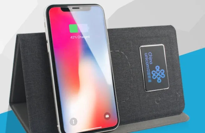 Folding wireless charging mouse pad set with cloth surface, compact mouse, and handbag.