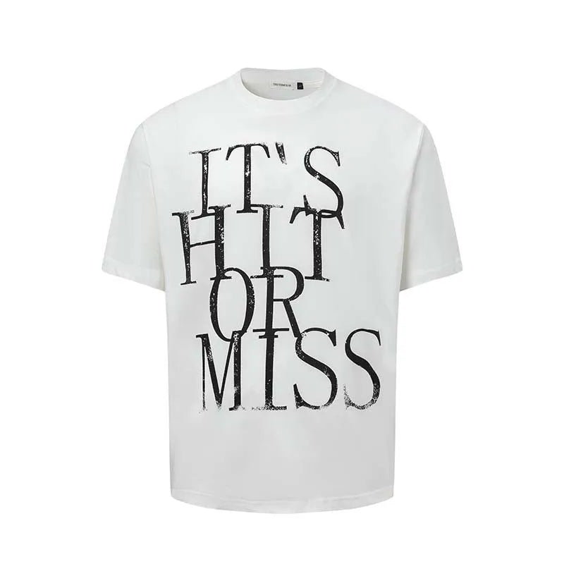 Man wearing a blue loose-fit American retro t-shirt with a white letter print design.