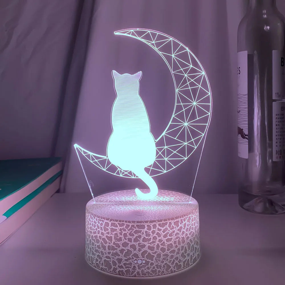 3D LED light moon and cat shape acrylic panel with remote control and USB cable on a dark surface
