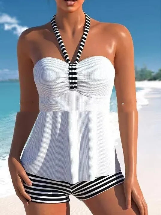 Women's off-shoulder one-piece swimsuit in solid white and black/white striped patterns.