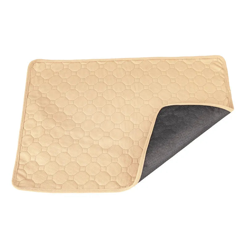 Pack of grey and tan washable, reusable dog pee pads in various sizes on a wooden floor.