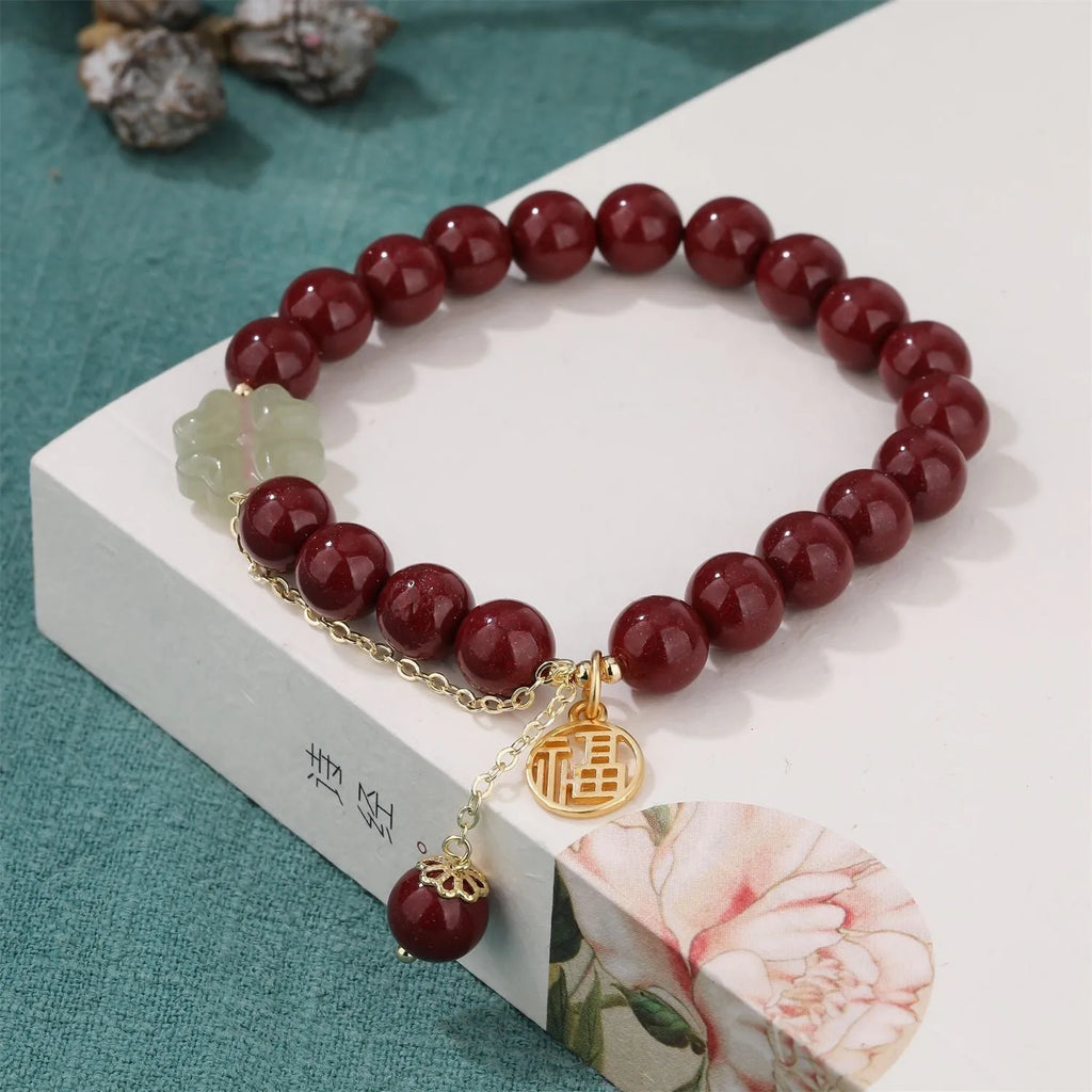 Women's cinnabar bracelet with purple gold sand colour and Fu character design elements