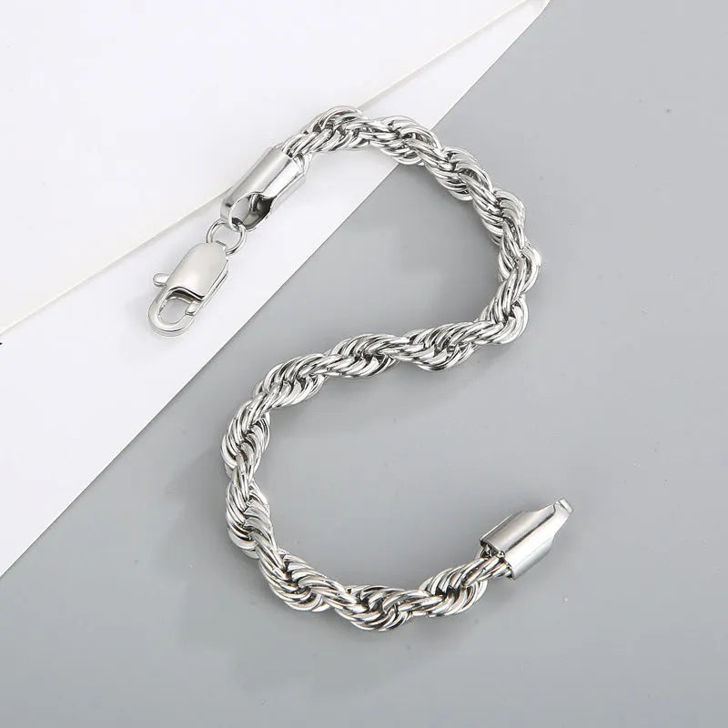 Gold double colour twist chain titanium steel bracelet with geometric design on white background