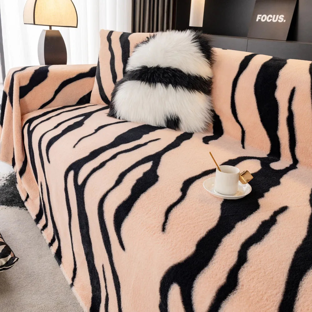 Zebra pattern flannel sofa slipcover in caramel colour showing non-slip underside and matching pillowcase
