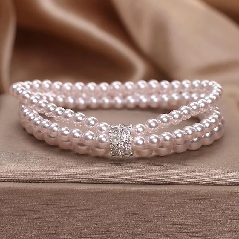 Baroque pearl multi-layer twin bracelet in white with electroplated finish on neutral background