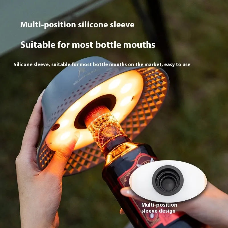 Beige wine bottle shaped camping lantern with USB-C charging port and compact dimensions