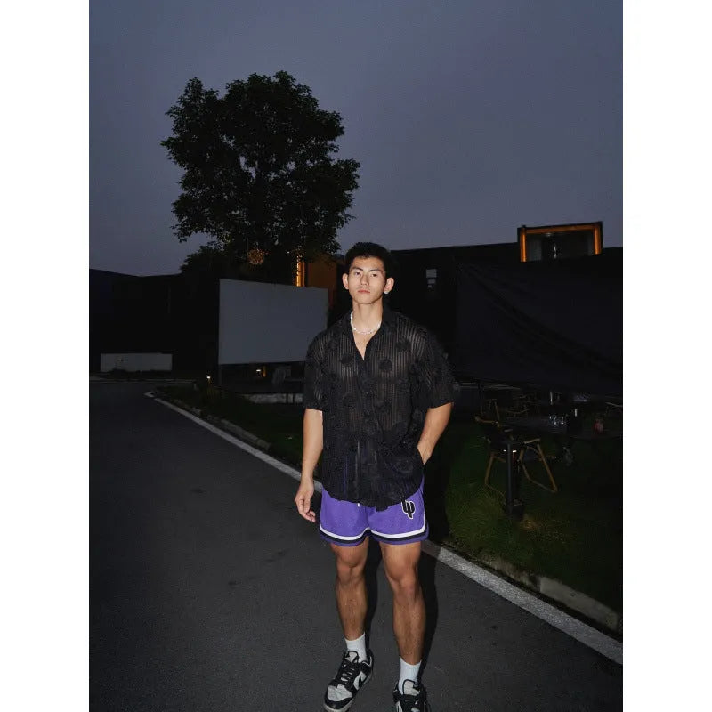 Man's loose fit short sleeve shirt with a heavy industry floral print in black.