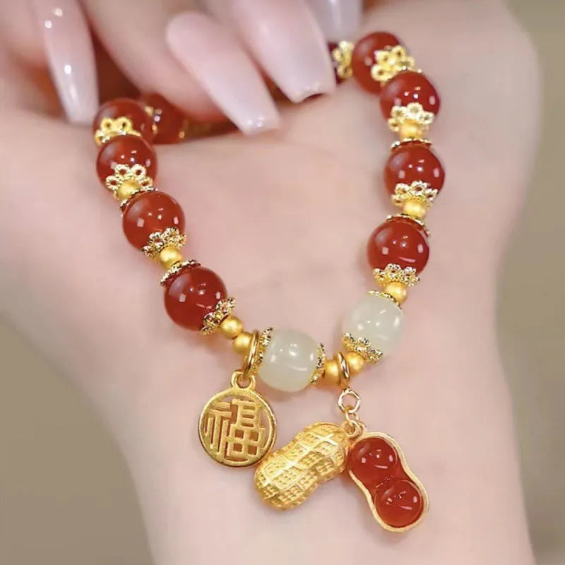 Chinese style glass bracelet with bamboo joint details in a red Lvzhu Duobao design.