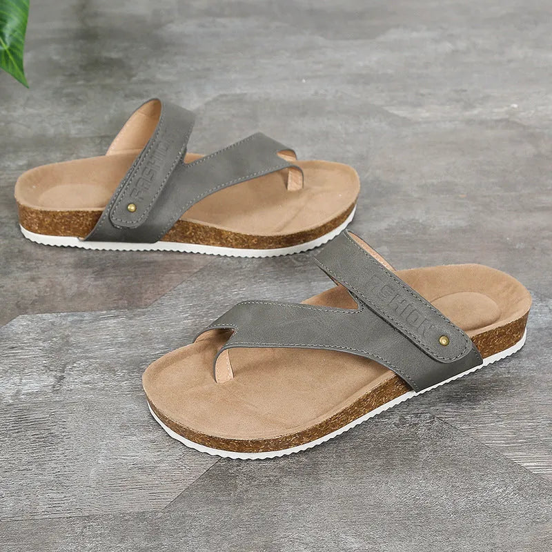 Flat toe ring thick-soled flip-flop in a solid colour on a plain background