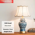 Blue and white porcelain Chinese table lamp with handmade ceramic body and cloth shade