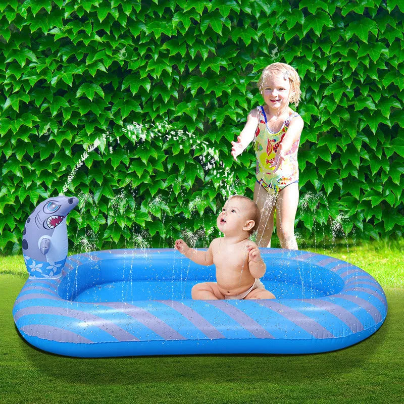 Blue dinosaur-themed water spray pool with shark toy measuring 170cm long for garden play