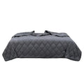 Polyester gravity blanket in solid light grey on bed, 152x203cm size, 12 lb weight option