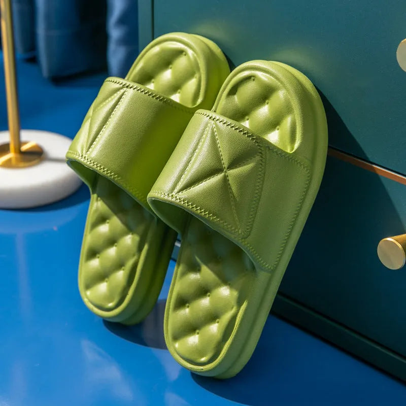 A pair of soft EVA bathroom slippers with a thick non-slip sole, shown in a choice of colours.