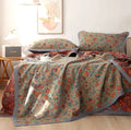 Cotton gauze bed blanket set with floral patterns showing blanket and two pillowcases