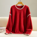 Women's acrylic pullover sweater in thick knit with long ruffle sleeves and patchwork design, available in apricot and red