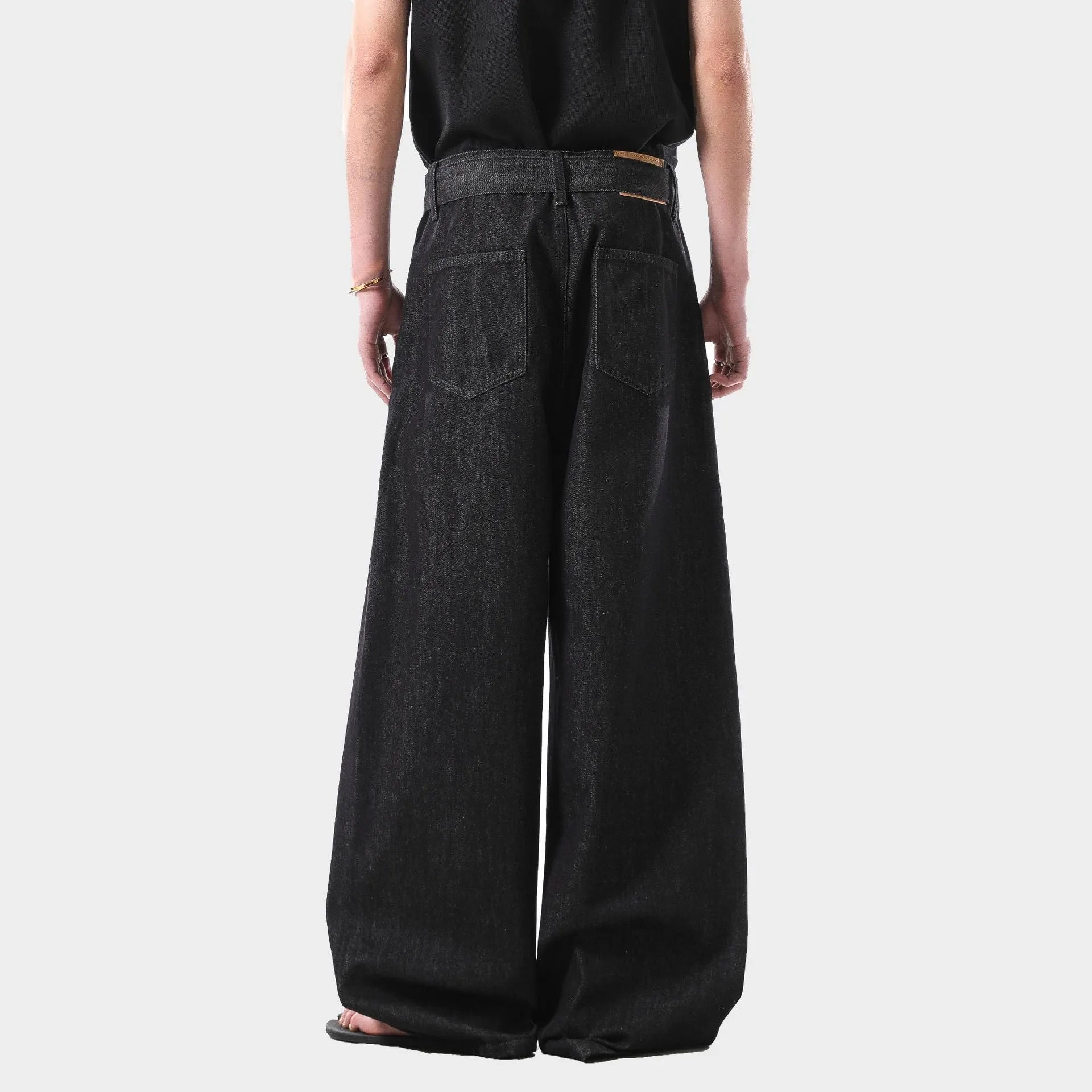 Black straight leg jeans with gold detailing and high waist design