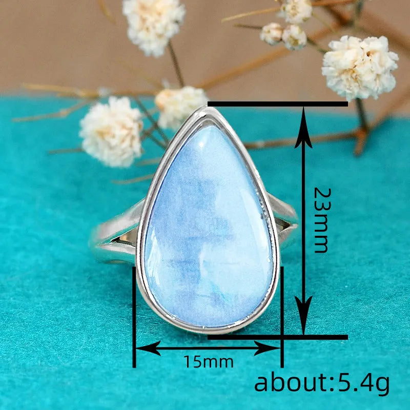 Women's copper water drop ring with white gold finish on white background