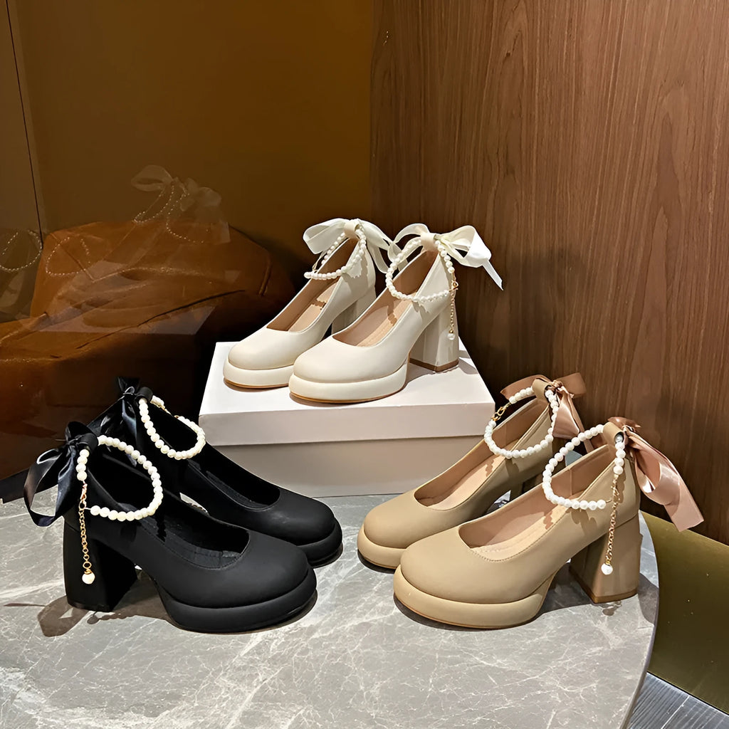 Women's beige Mary Jane shoes with a chunky heel, round toe, and a buckle fastening on the ankle strap.