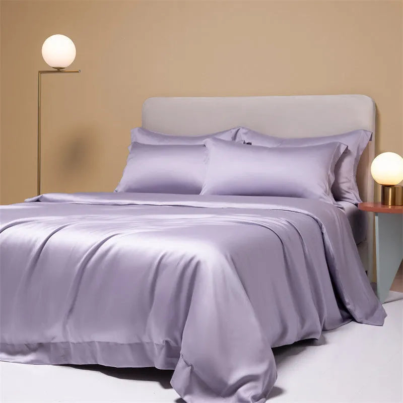 Luxury Lenzing Tencel quilt cover and pillowcase set in a modern style, showing colour options like Aurora Blue.