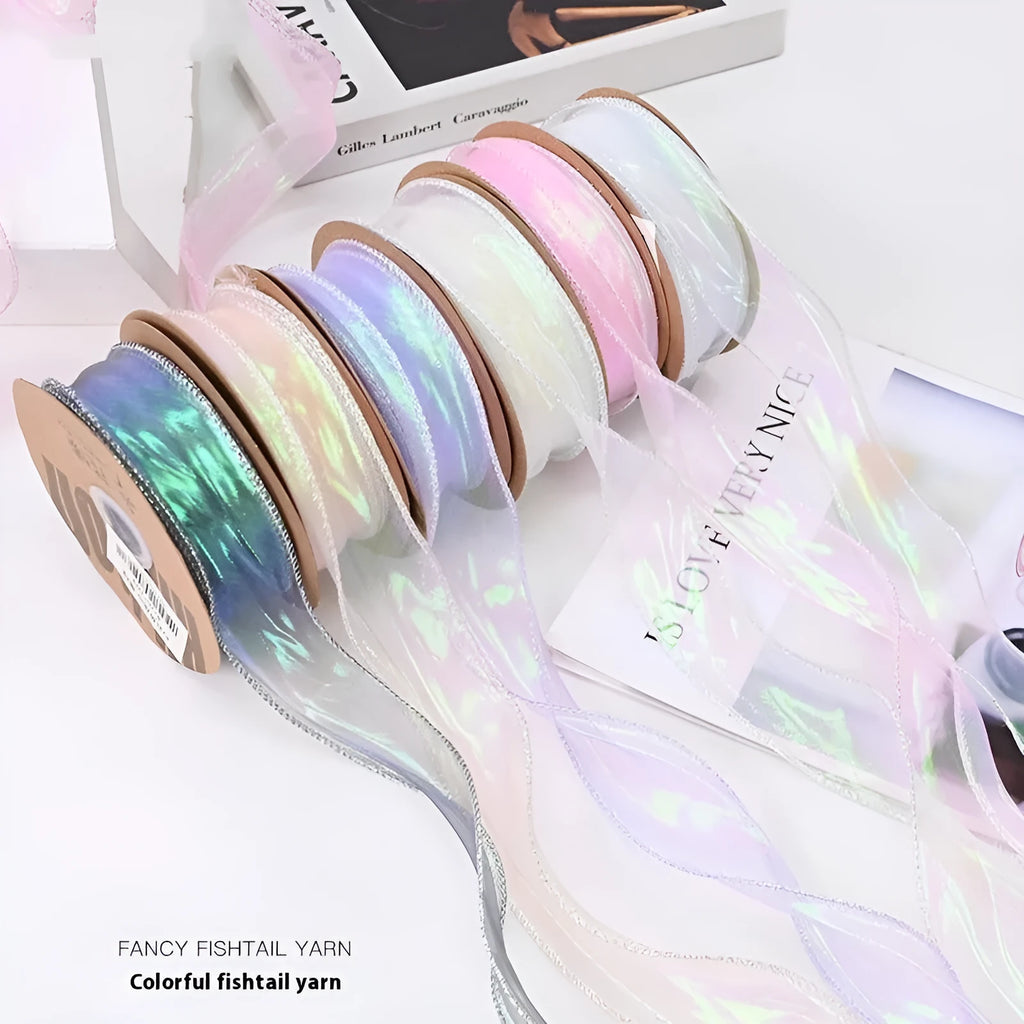 Fishtail yarn wave ribbon in various illusion colours showing 4cm width and textured mesh construction