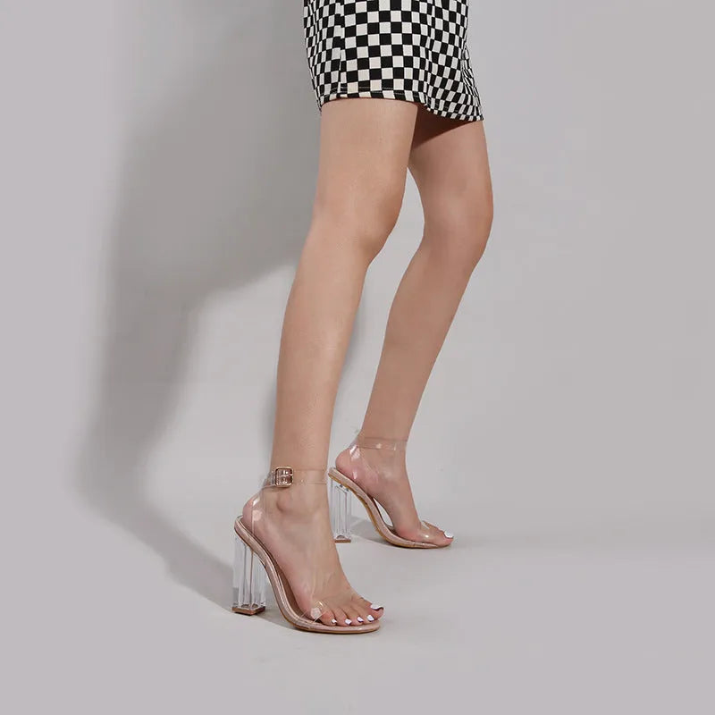 Apricot coloured women's high heel sandals with glass heels, round toe, and a buckle strap.