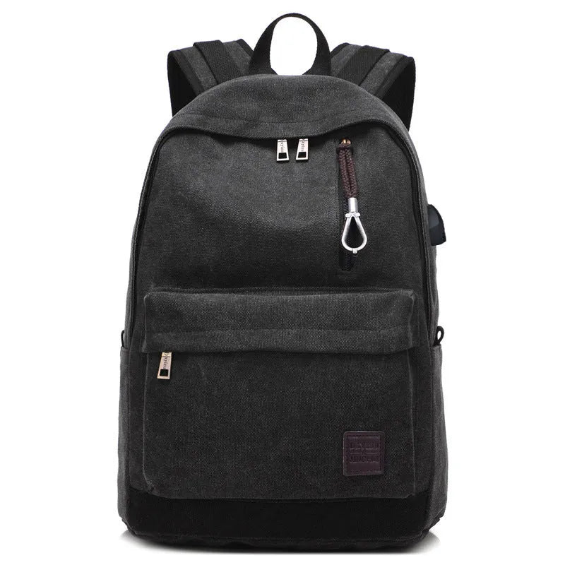 Canvas backpack with USB charging port showing multiple compartments including laptop pocket