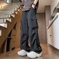 Black waterproof plus size loose fit straight-leg trousers with a drawstring waist.