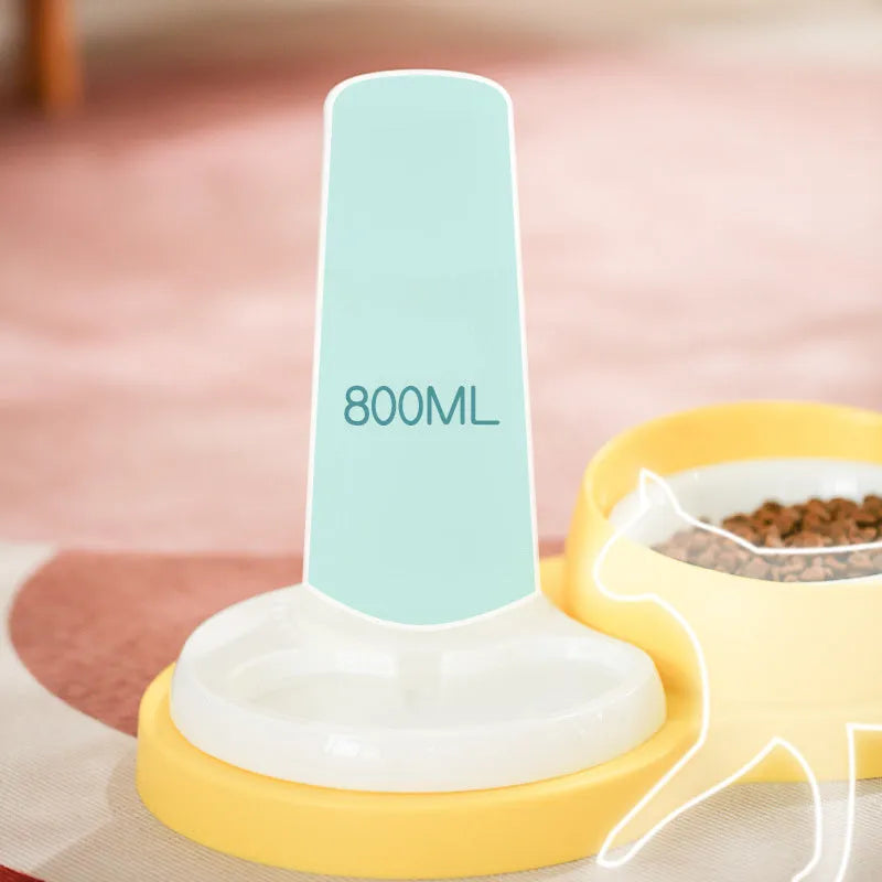 Grey and yellow pet dual feeding bowl with ceramic dish and stainless steel water dispenser on non-slip base