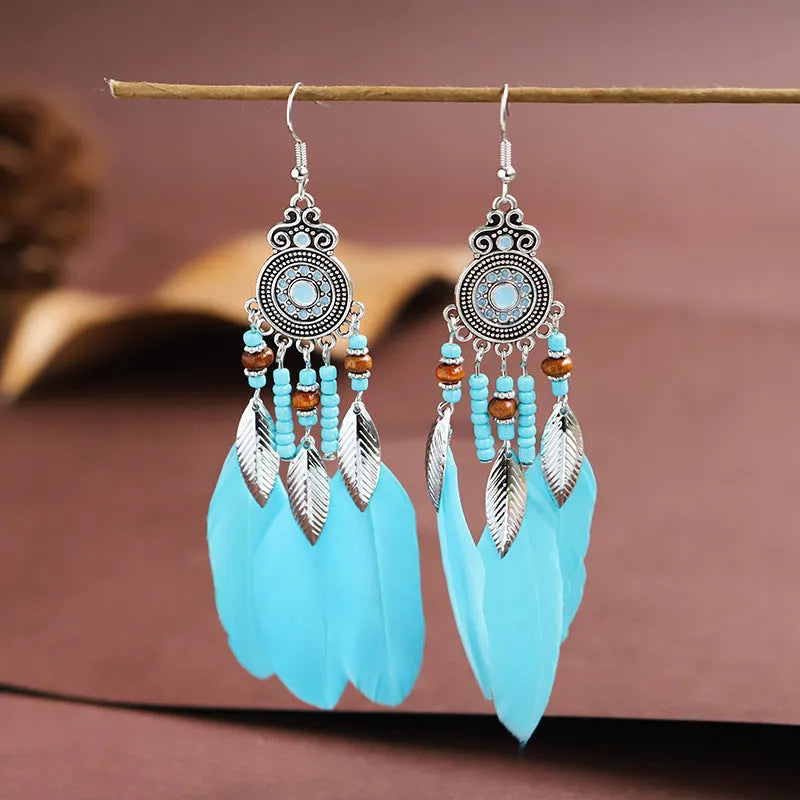 Round drop feather design alloy earrings with leaf pattern in a bohemian style, showing electroplated finish.