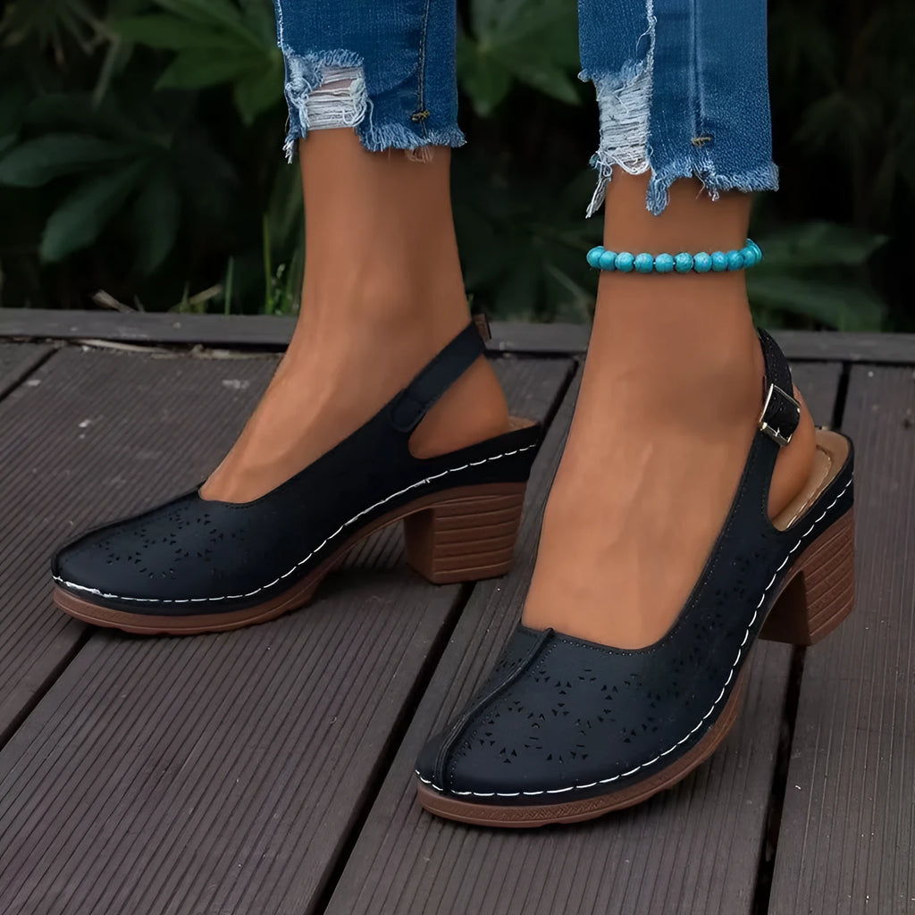 Women's black closed toe wedge sandals with a rounded toe and PU upper on a rubber sole.